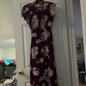 Purple floral romper dress with a. High low style